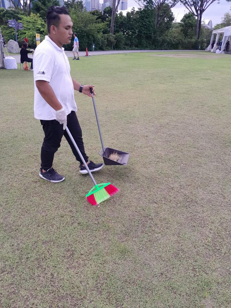 person cleaning after an event