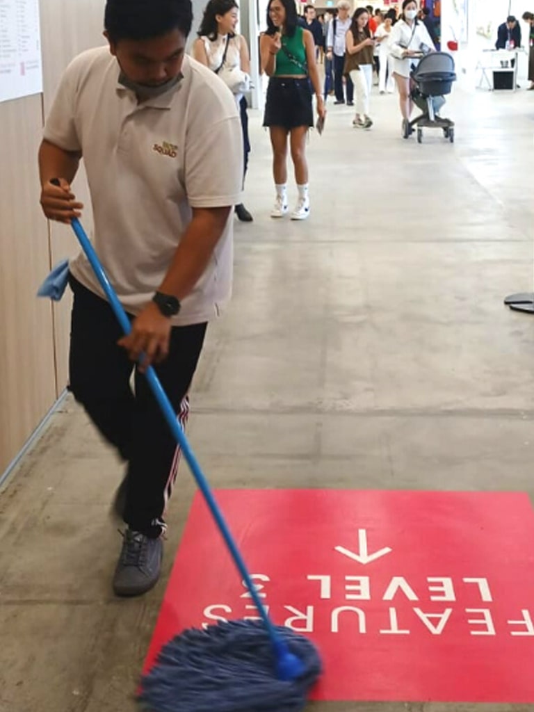 person mopping the event venue